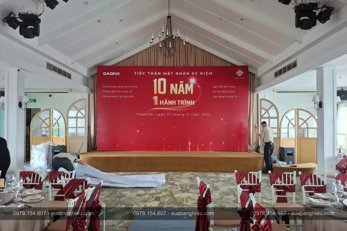 Backdrop Bạt Hiflex Sự Kiện Tiện Thân Mật Nhân Kỷ Niệm 10 Năm 1 Hành Trình Của Cadivi